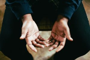 Hands raised in prayer