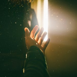 Hand reaching light